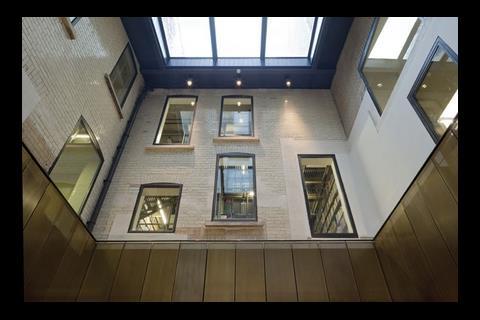 A lightwell in the centre of the building was wasting valuable space so has been turned into a new periodicals reading room. The image shows the finished article.